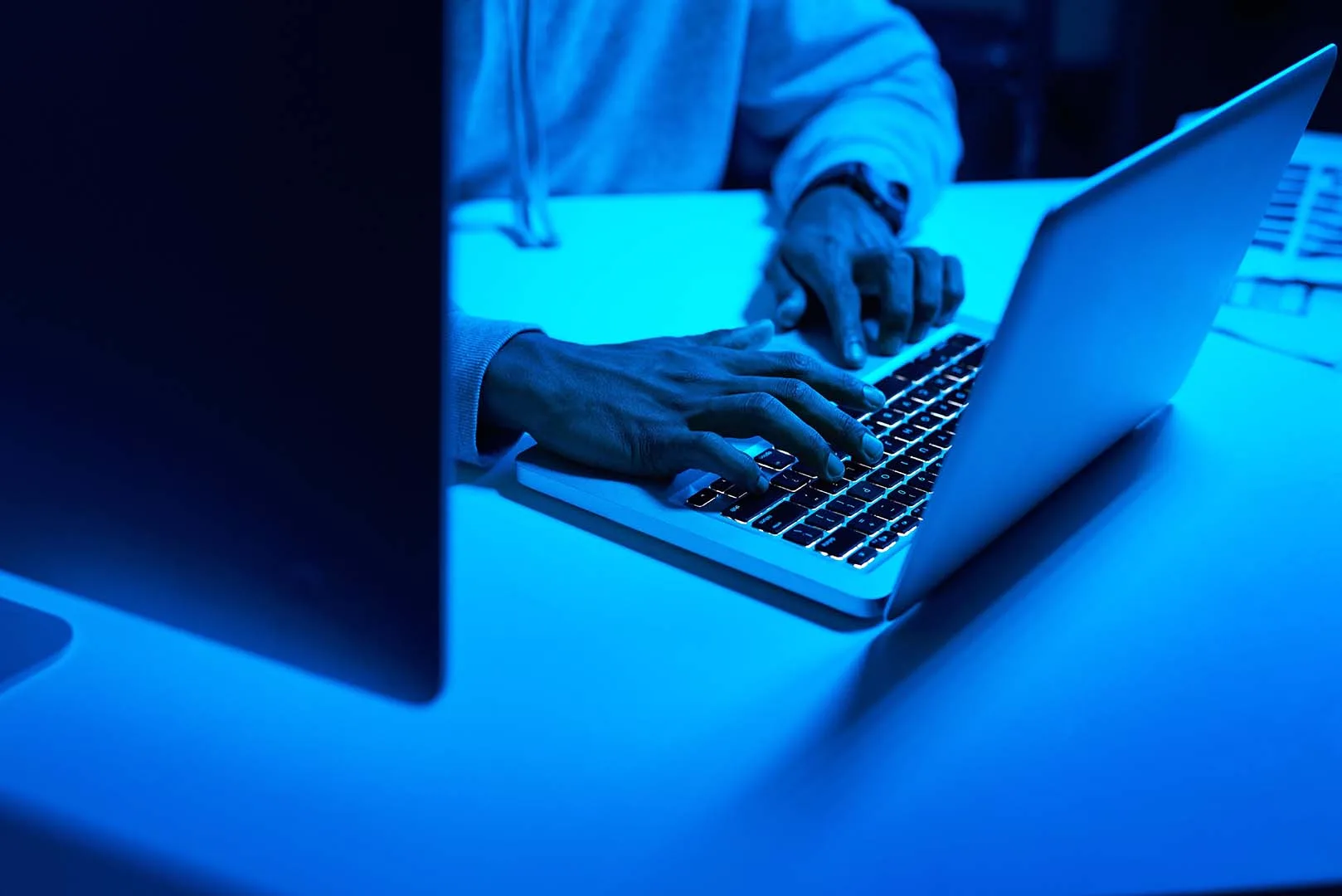 Developer actively working on a laptop during a collaborative coding session